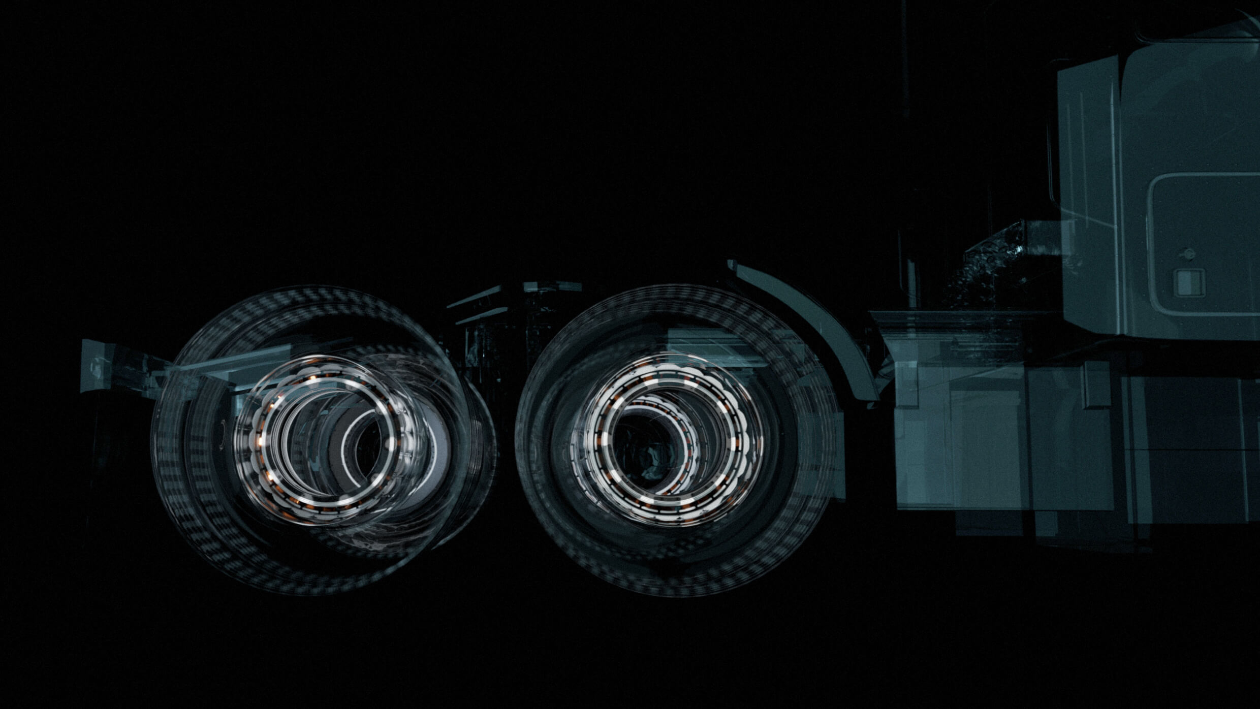 Abstract: Two circular patterns resembling vehicle wheels against a dark background create a futuristic illusion with overlapping shapes and transparent layers, invoking a sense of motion and technology.