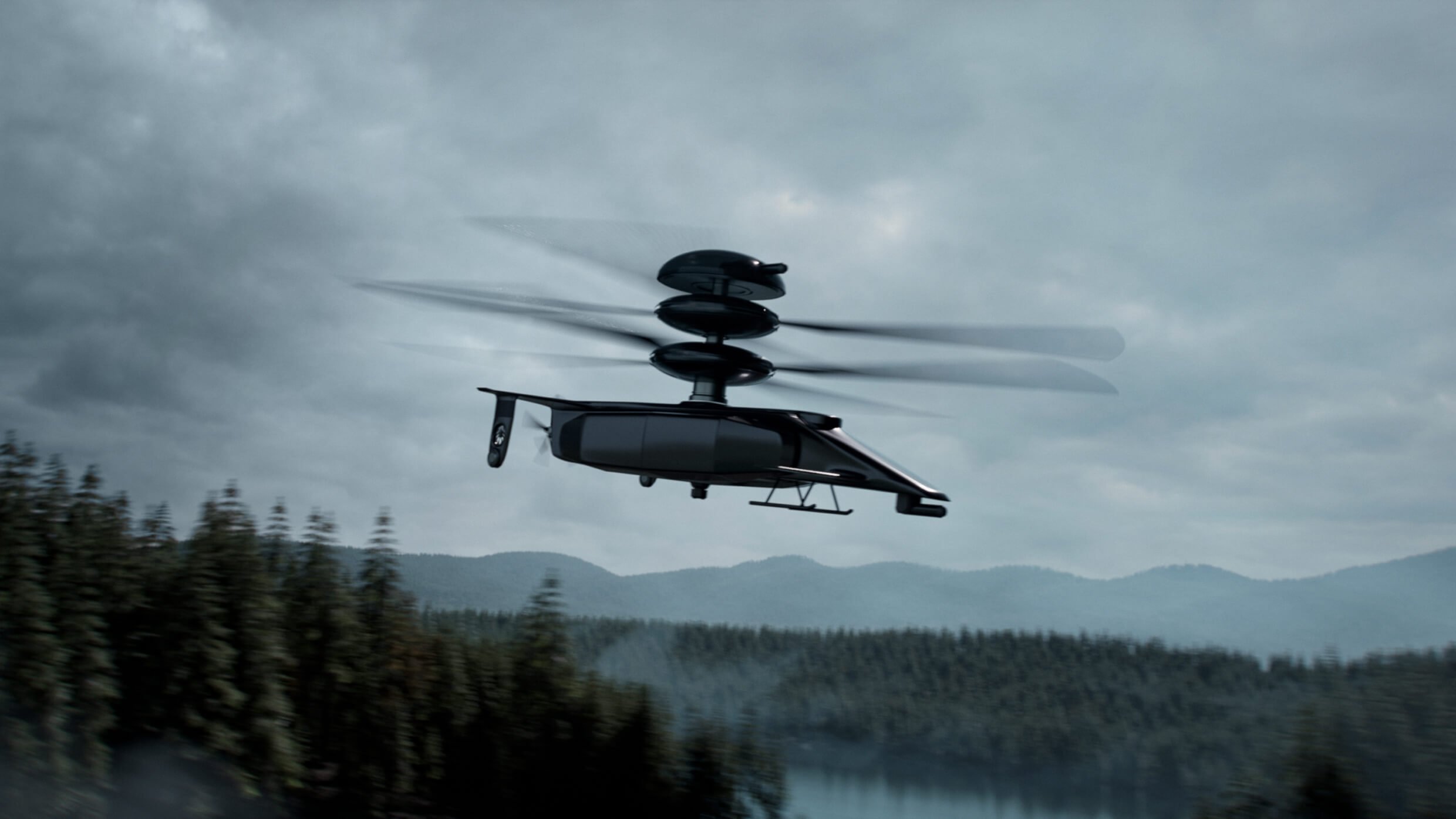hyperq A futuristic drone helicopter with multiple rotor blades hovers in a cloudy sky above a forested landscape, with misty hills in the distance.